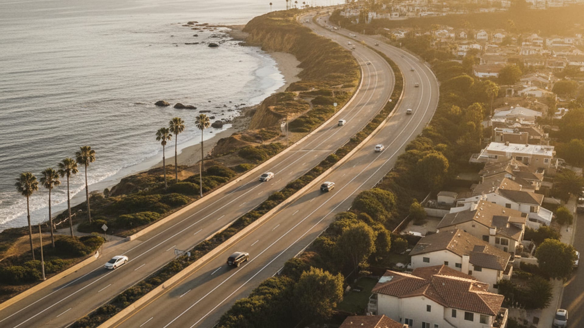 Aerial view of Los Angeles County freeway network at golden hour showing Santa Monica through the San Fernando Valley to Palmdale